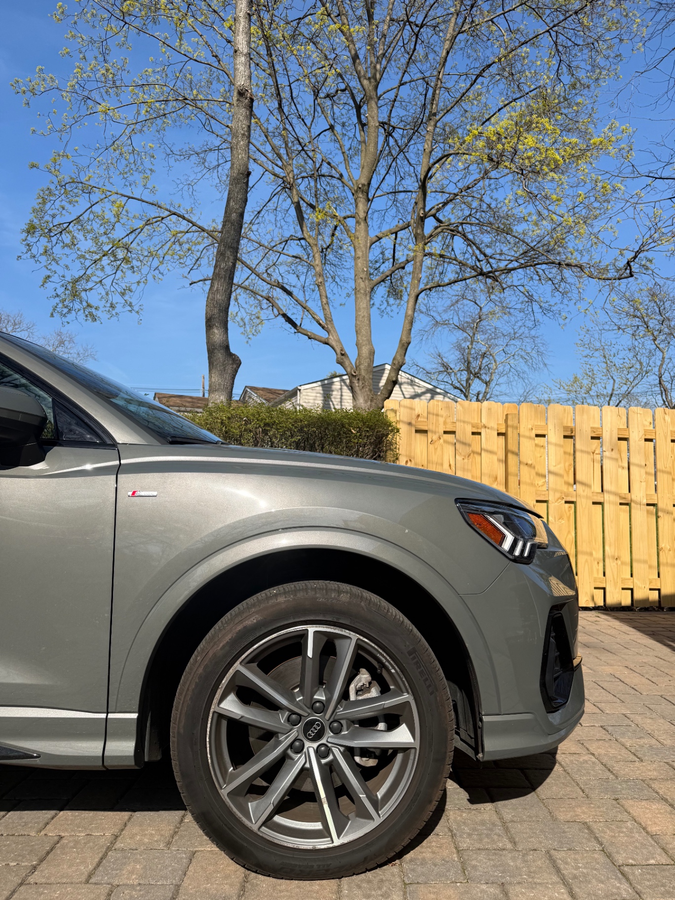 Audi Q3 with dusty paint and dirty wheels before detailing