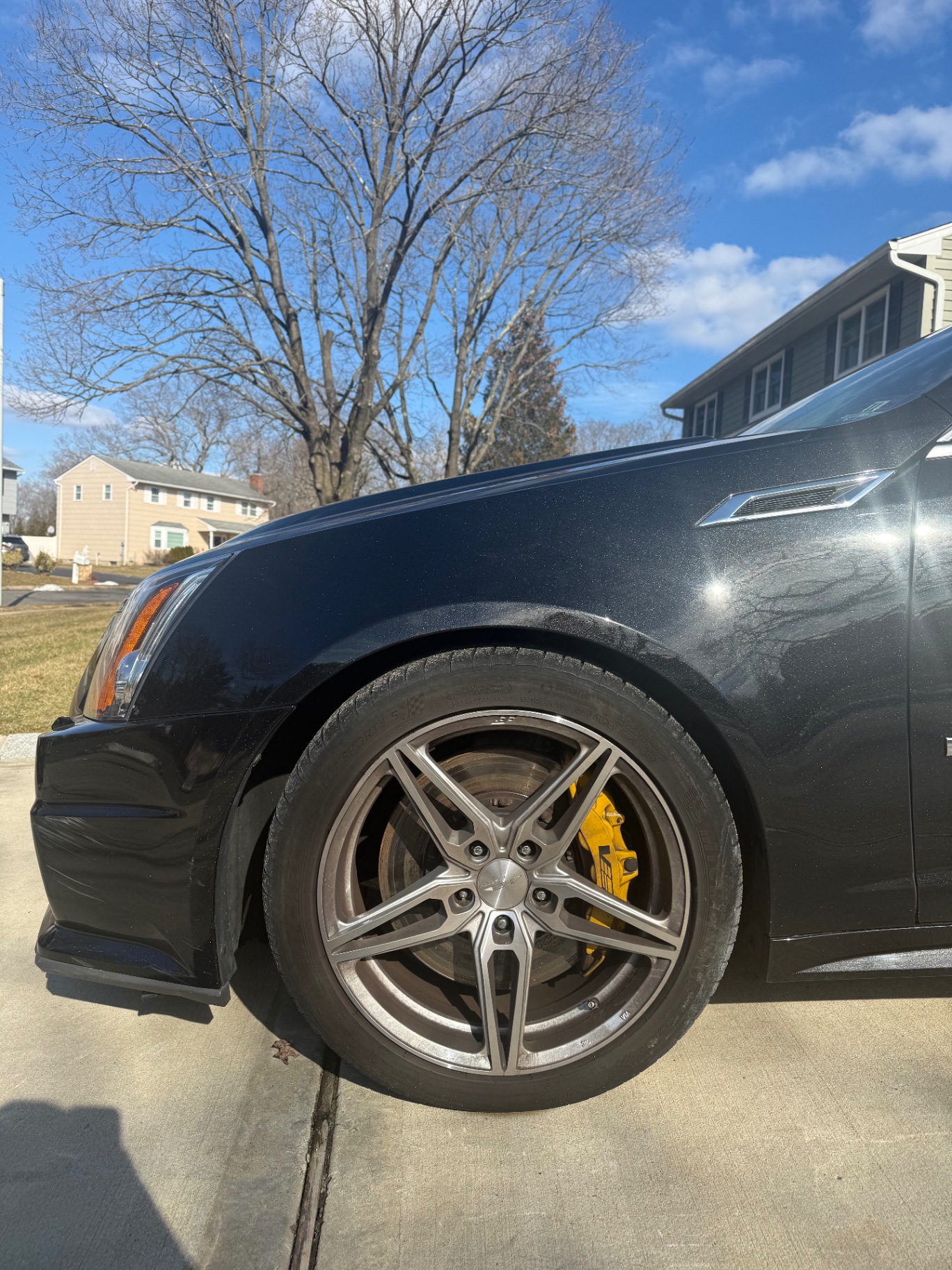 Cadillac CTS-V with dusty paint and dirty wheels before detailing